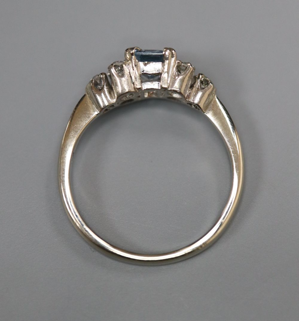 An 18ct white metal, aquamarine and diamond cluster dress ring, size P/Q, gross 3.7 grams.